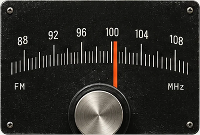 An FM tuning dial with an orange needle resting at 100.